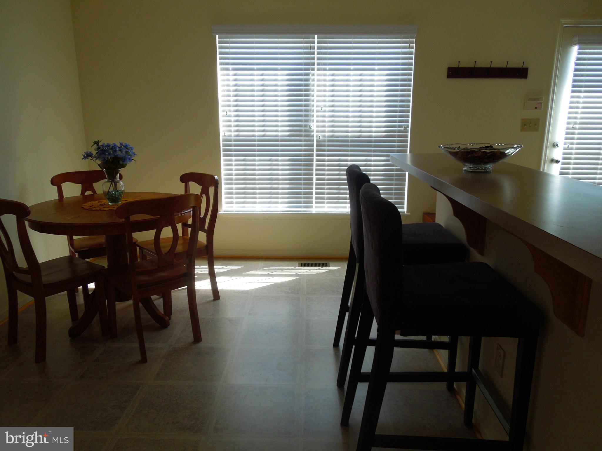 16808 Centerfield Way Olney, MD 20832 - Photo 8 of 22 a dining room with furniture and window