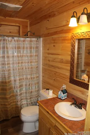 a bedroom with a bed and a stove