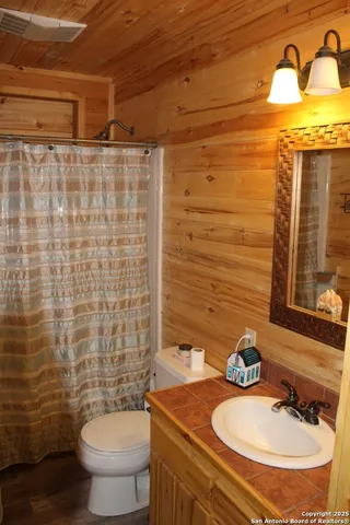 a bedroom with a bed and a stove