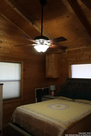 a bed room with a bed and a window