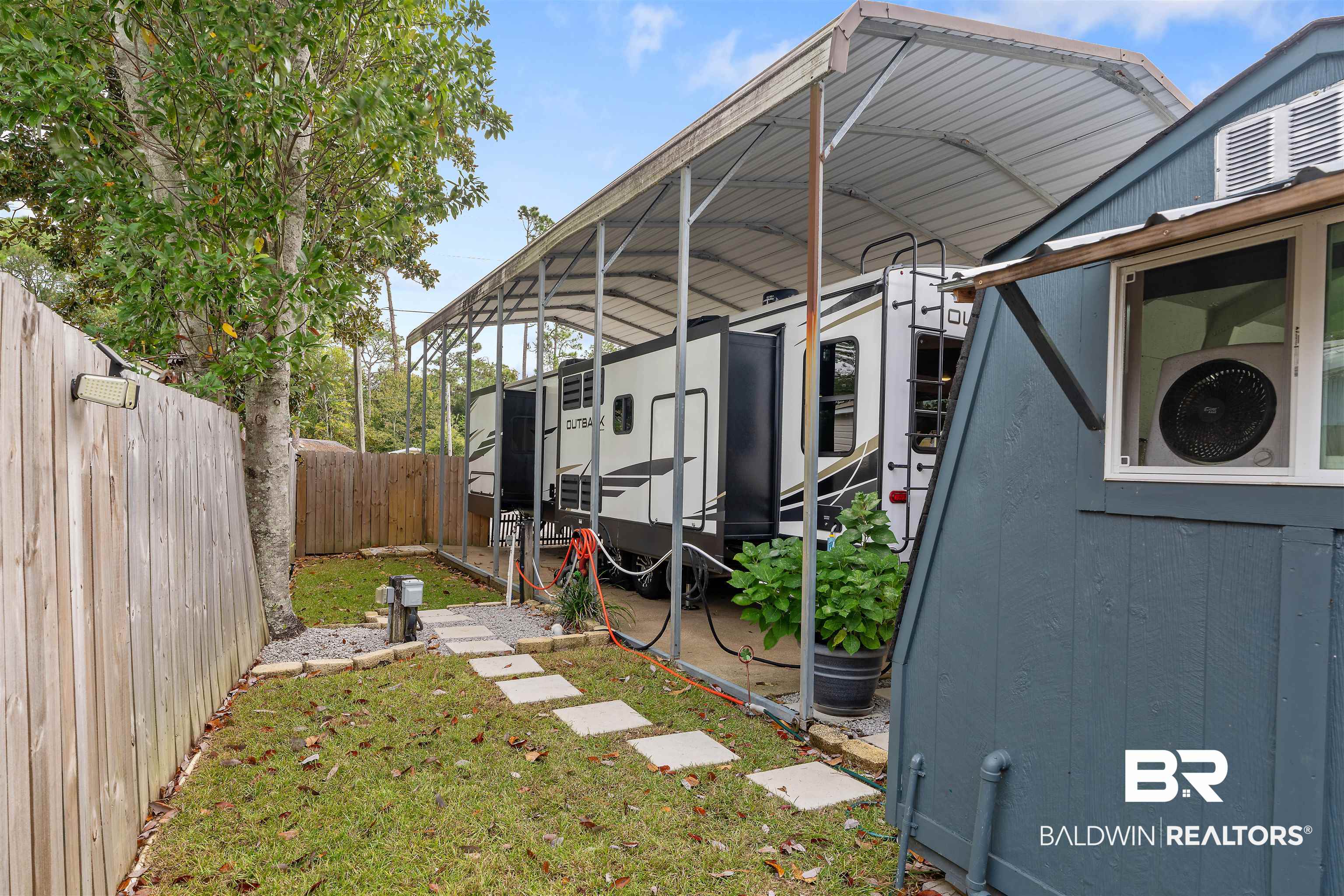 683 Escambia Loop Lillian, AL 36549 - Photo 19 of 27 View of yard with a carport
