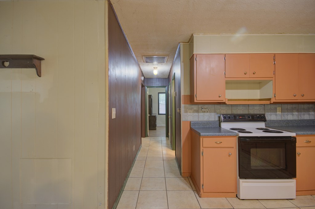92 No-Where Road Blairsville, GA 30512 - Photo 9 of 36 a kitchen with stainless steel appliances granite countertop a stove and a sink