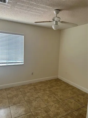 a view of a room that has a window in it