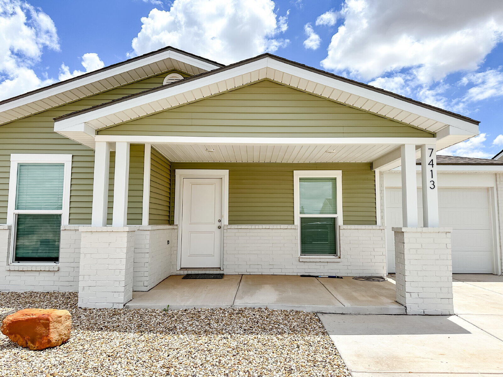 7413 35th Street Lubbock, TX 79407 - Photo 2 of 9 a view of a house with a yard