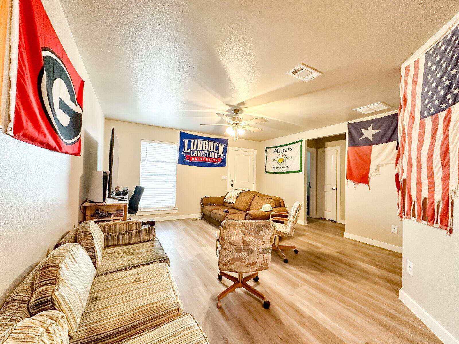 7413 35th Street Lubbock, TX 79407 - Photo 3 of 9 a living room with furniture and a rug