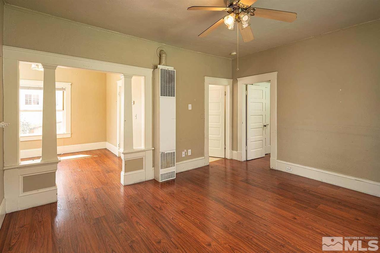 321 Cheney Street Reno, NV 89502 - Photo 4 of 18 a view of an empty room with window and wooden floor