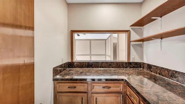 a view of a kitchen counter space and window