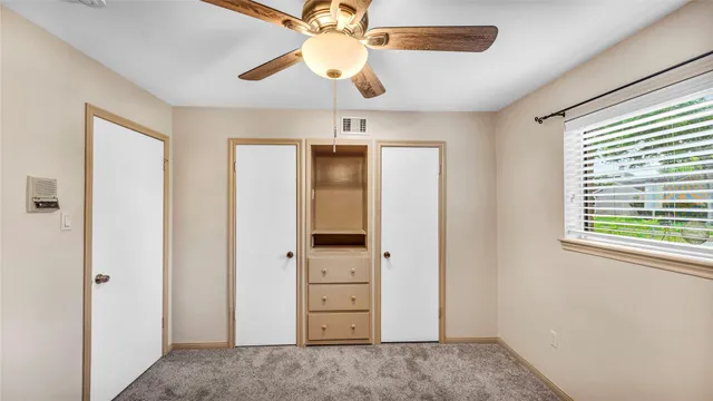 a spacious bathroom with a bathtub sink and mirror
