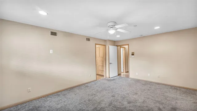 a en suite bathroom with a sink and a mirror