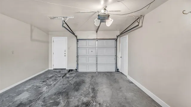 a view of a backyard with wooden fence