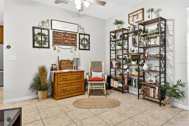 a room with furniture and a potted plant