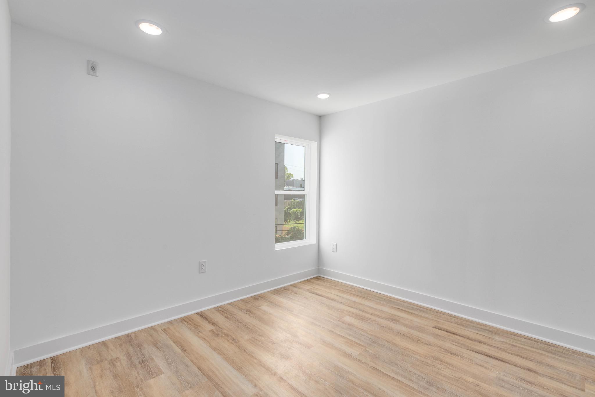 2339 North 16th Street, Unit 2 Philadelphia, PA 19132 - Photo 5 of 10 a view of empty room with wooden floor and fan