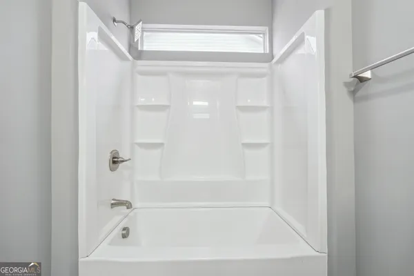 a close up of a bathtub curtain