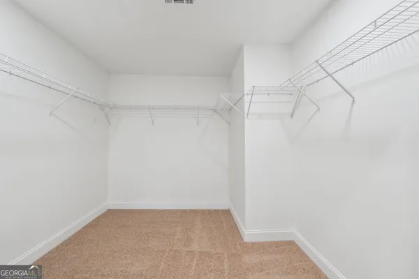 a view of a room with racks on the wall