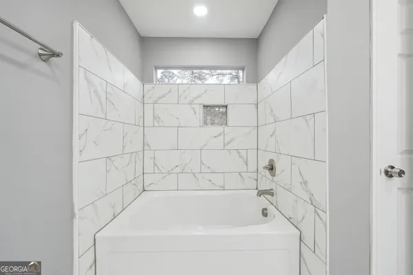 a bathroom with a bathtub