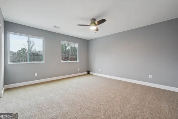 a view of an empty room with a window