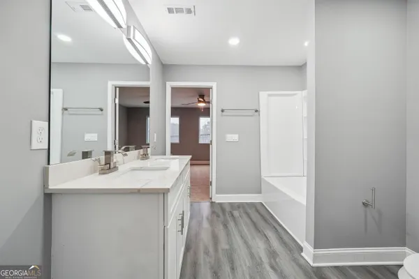 a bathroom with a sink and mirror
