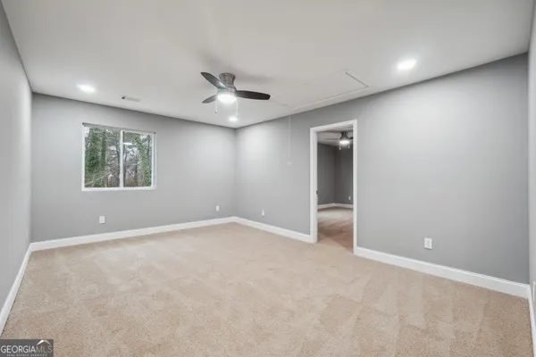 a view of an empty room with a window