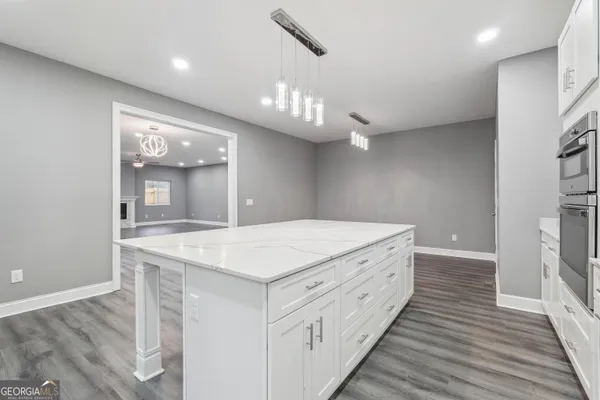 a bathroom with a sink a vanity and a mirror