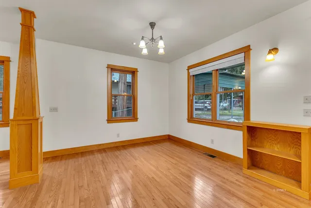 a view of an entryway with wooden floor