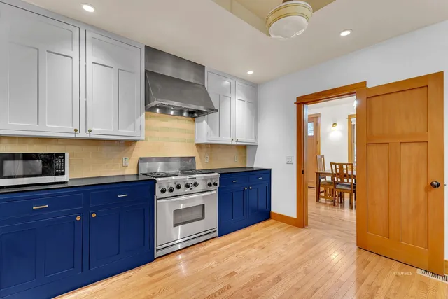 a bathroom with a sink vanity and a mirror