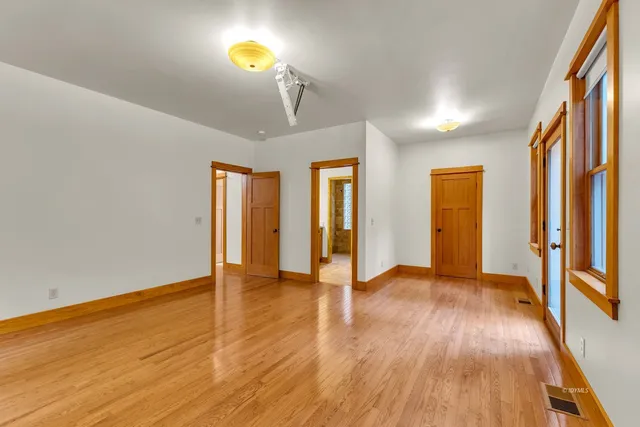 a view of a hallway with stairs