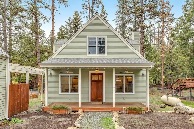a view of a livingroom with furniture and an empty room