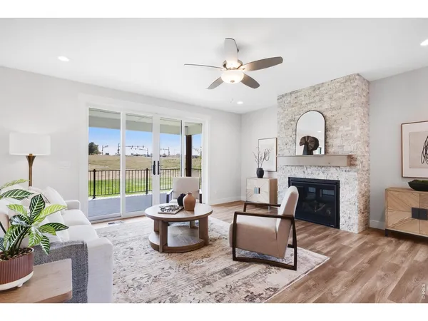 a living room with furniture and fireplace