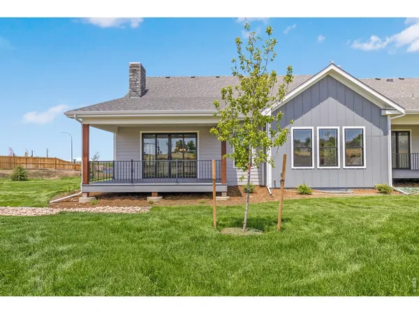 a view of a house with yard and a garden