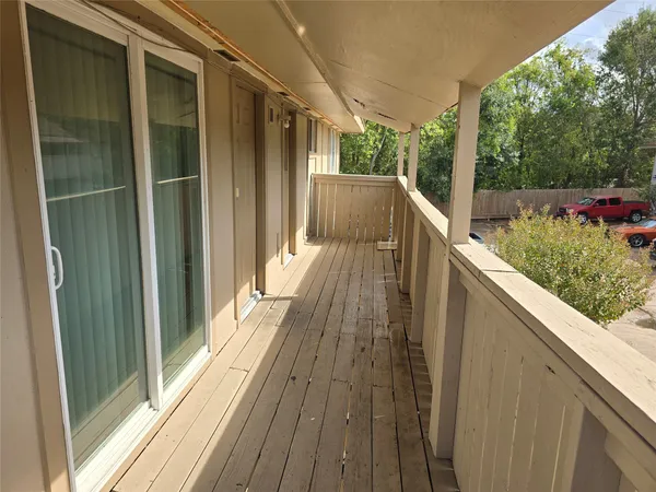a view of balcony with wooden floor and outdoor space