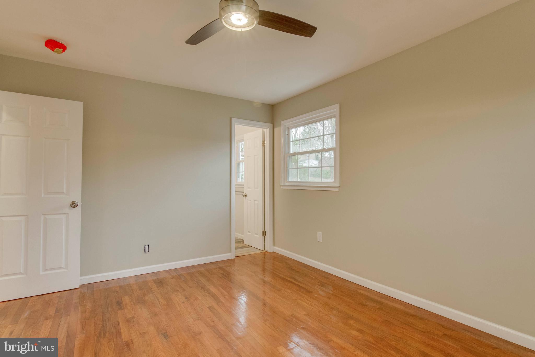 13405 Kingsman Road Woodbridge, VA 22193 - Photo 16 of 42 Master Bedroom with Refinished Hardwood Floors