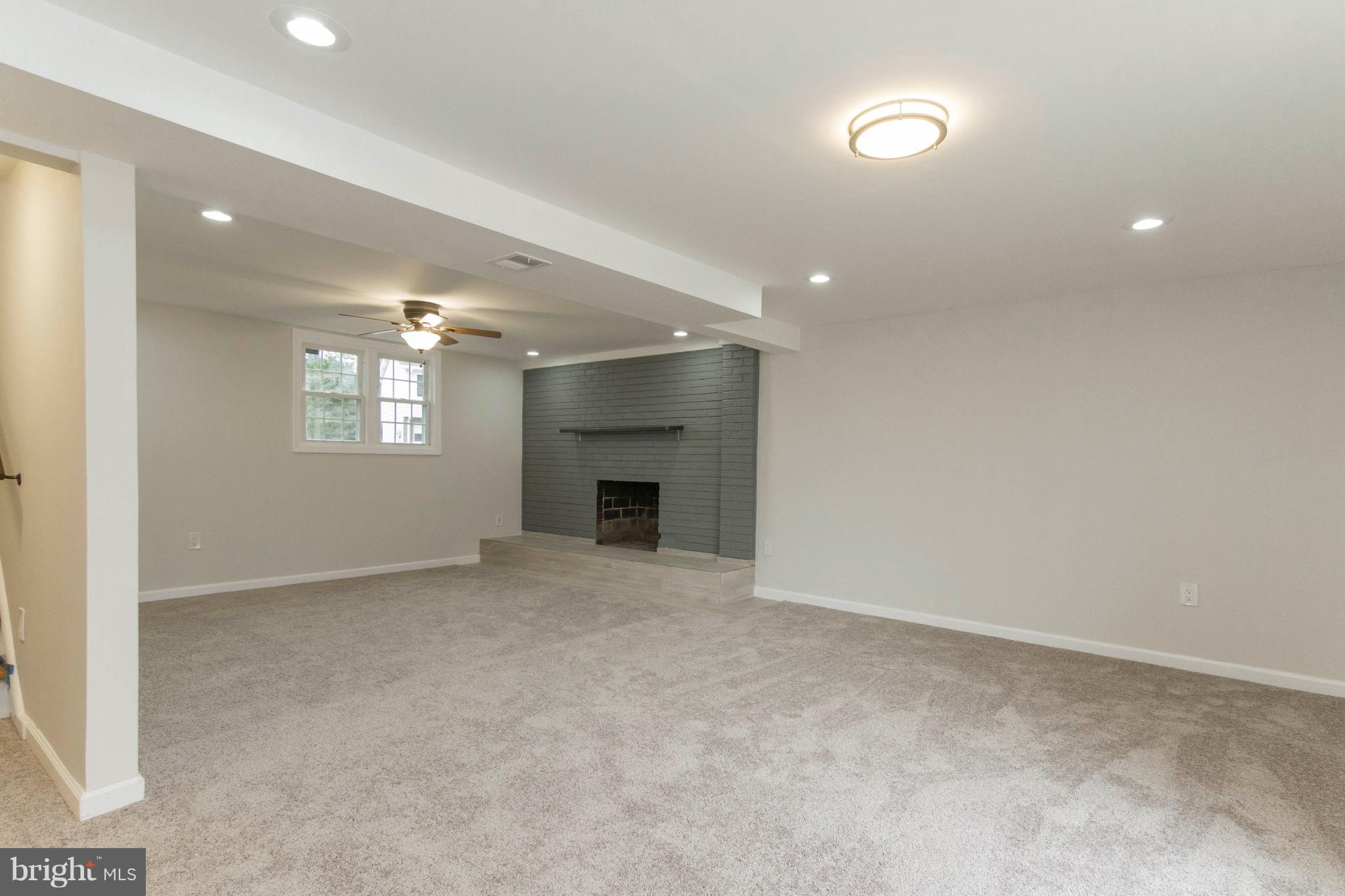 13405 Kingsman Road Woodbridge, VA 22193 - Photo 26 of 42 Finished Basement Rec Room w/ Wood Burning FP
