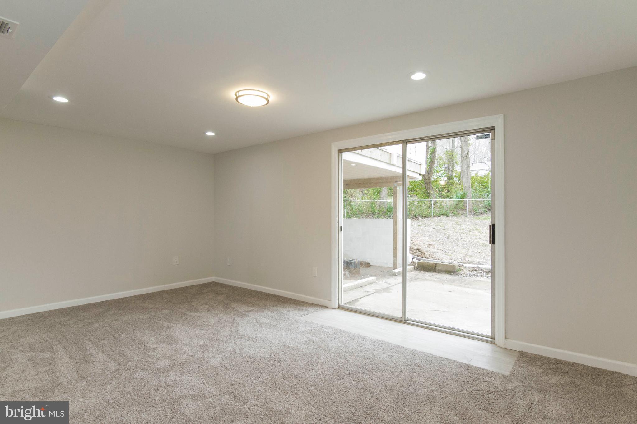 13405 Kingsman Road Woodbridge, VA 22193 - Photo 29 of 42 Basement Rec Room with Walk-out to Rear Yard