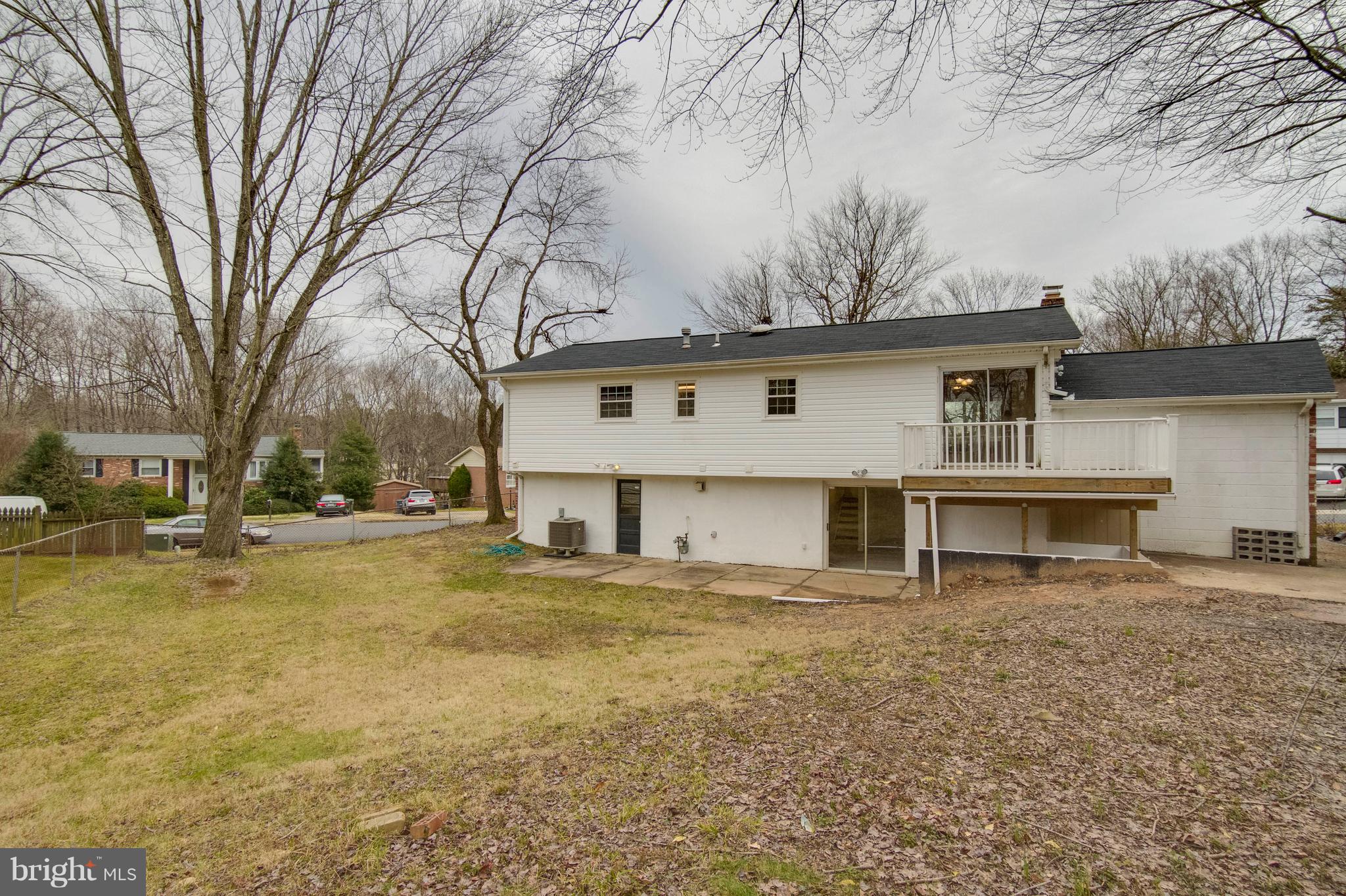 13405 Kingsman Road Woodbridge, VA 22193 - Photo 39 of 42 Rear View with Deck and Fenced Yard