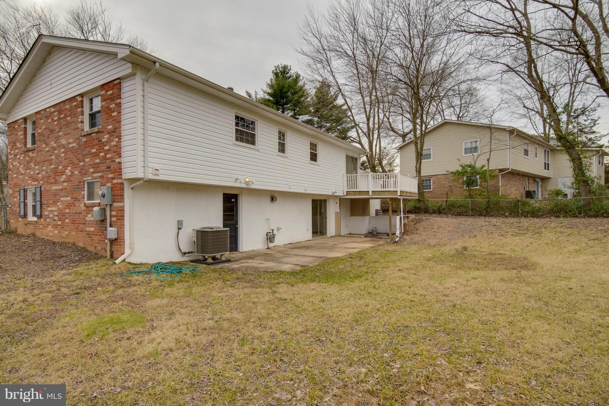 13405 Kingsman Road Woodbridge, VA 22193 - Photo 40 of 42 Rear View with Patio, Deck and Sizable Yard