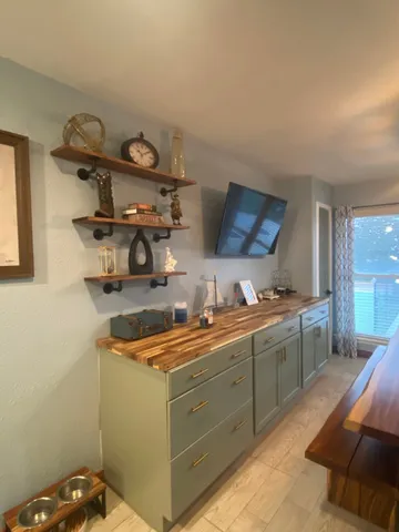 a kitchen with a sink and cabinets