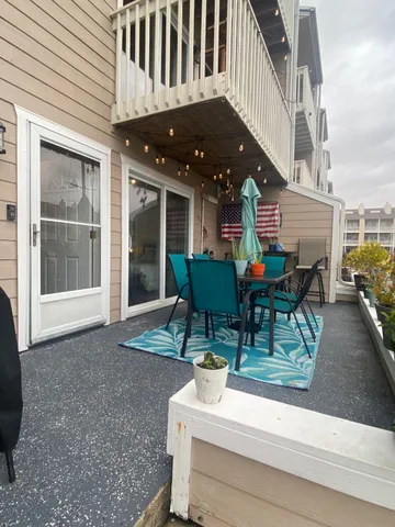 a view of a patio with a yard