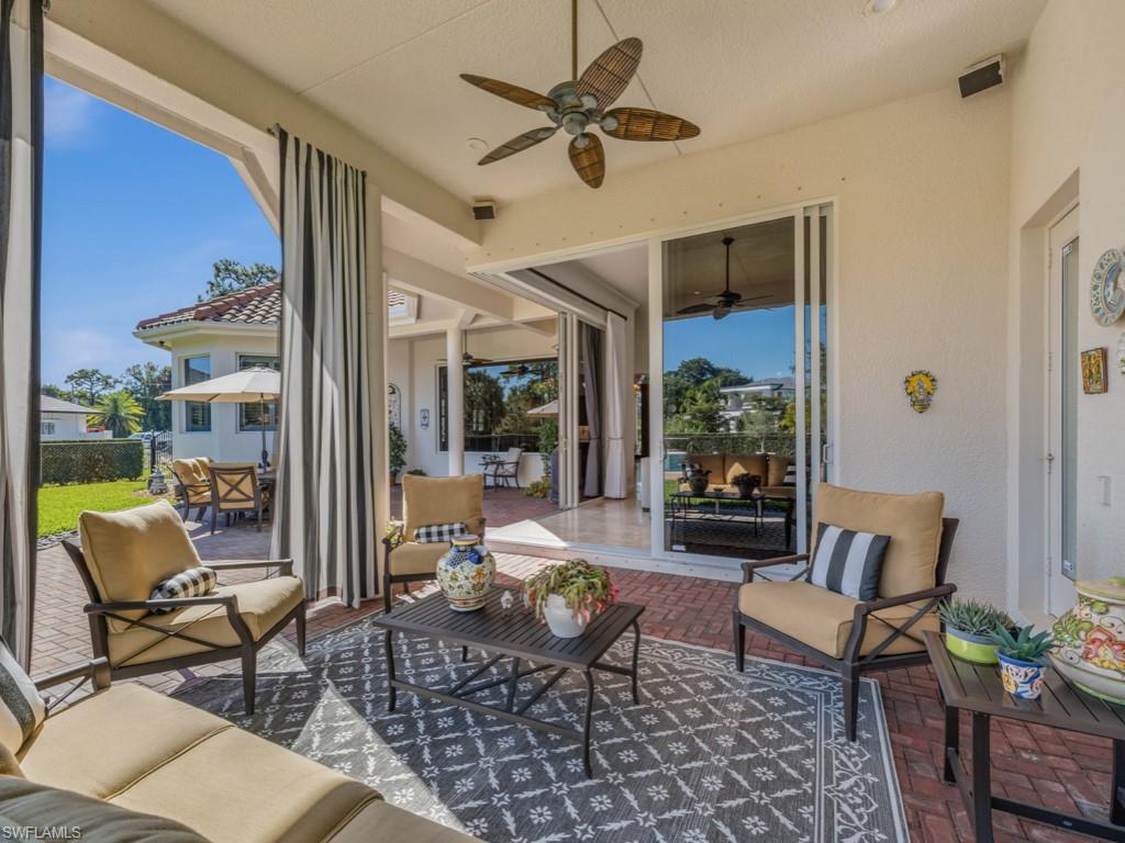 506 Ridge Drive Naples, FL 34108 - Photo 23 of 33 Sunroom featuring an outdoor hangout area, a patio, ceiling fan, and outdoor dining area