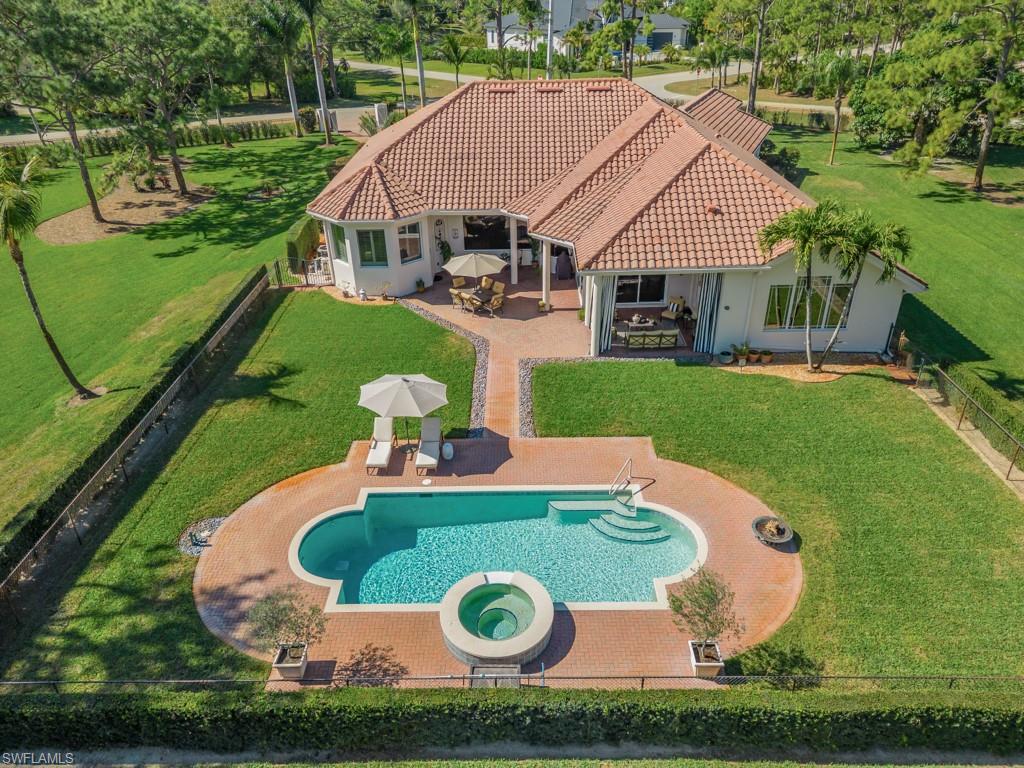 506 Ridge Drive Naples, FL 34108 - Photo 28 of 33 Aerial view of property and surrounding area featuring a pool
