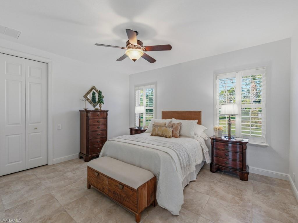 506 Ridge Drive Naples, FL 34108 - Photo 31 of 33 Bedroom with ceiling fan and a closet