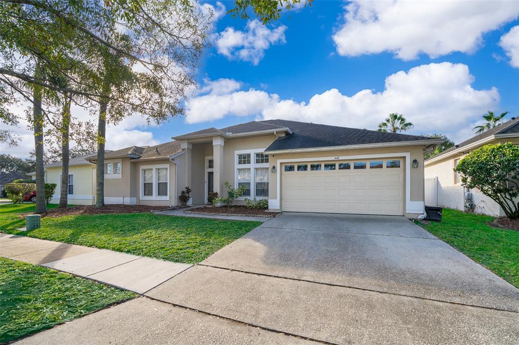 418 Rockafellow Way Orlando, FL 32828 - Photo 1 of 1 front view of a house with a yard