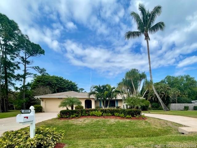 8552 Southwest 17th Avenue Stuart, FL 34997 - Photo 1 of 25 a house with swimming pool in front of it