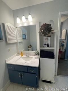 8552 Southwest 17th Avenue Stuart, FL 34997 - Photo 16 of 25 a bathroom with a sink and a mirror