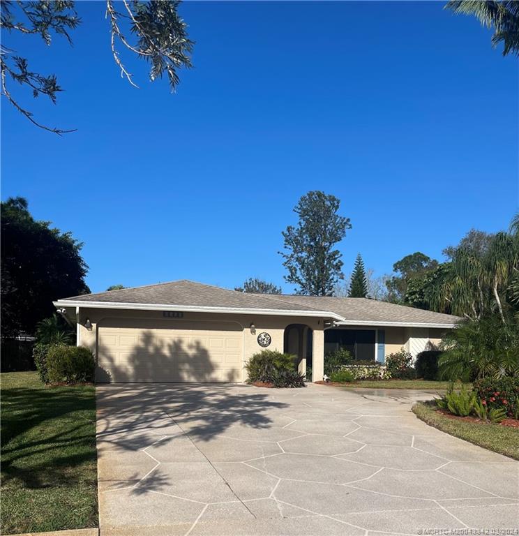 8552 Southwest 17th Avenue Stuart, FL 34997 - Photo 2 of 25 a view of a house with a yard