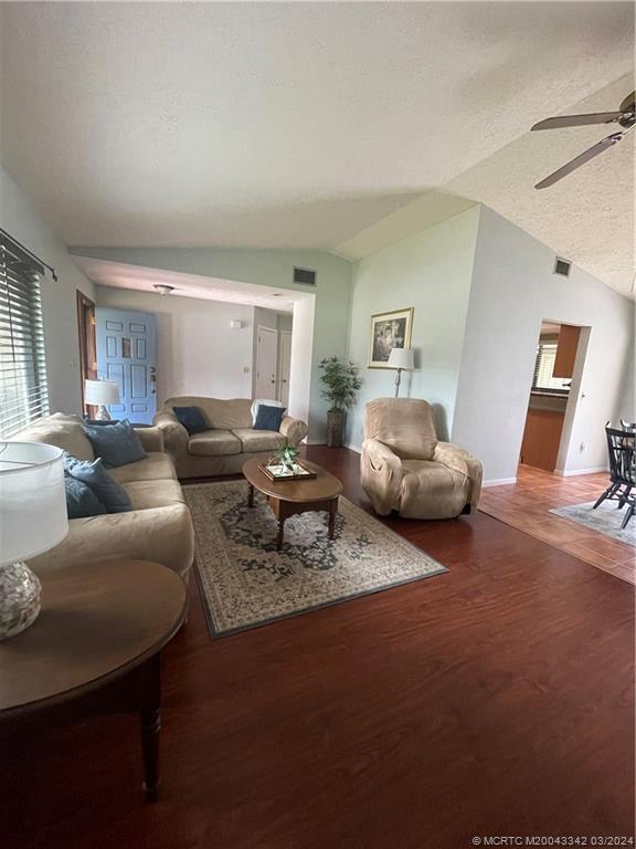 8552 Southwest 17th Avenue Stuart, FL 34997 - Photo 8 of 25 a living room with furniture and a window