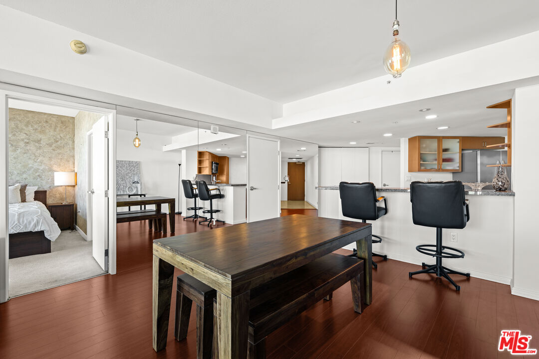 13700 Marina Pointe Drive, Unit 1007 Marina del Rey, CA 90292 - Photo 15 of 53 a view of kitchen and dining room with wooden floor