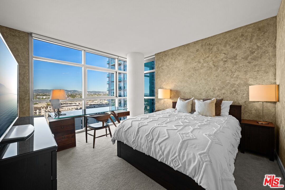 13700 Marina Pointe Drive, Unit 1007 Marina del Rey, CA 90292 - Photo 16 of 53 a bedroom with a bed and large windows