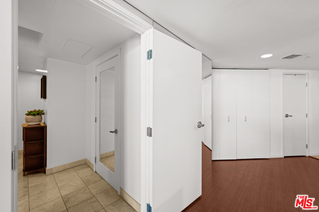 13700 Marina Pointe Drive, Unit 1007 Marina del Rey, CA 90292 - Photo 24 of 53 a view of a hallway with closet and a bathroom