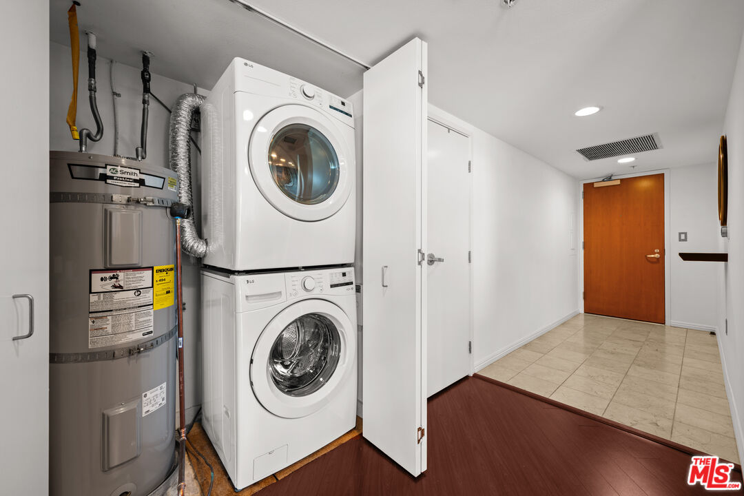 13700 Marina Pointe Drive, Unit 1007 Marina del Rey, CA 90292 - Photo 26 of 53 a view of a hallway with washer and dryer