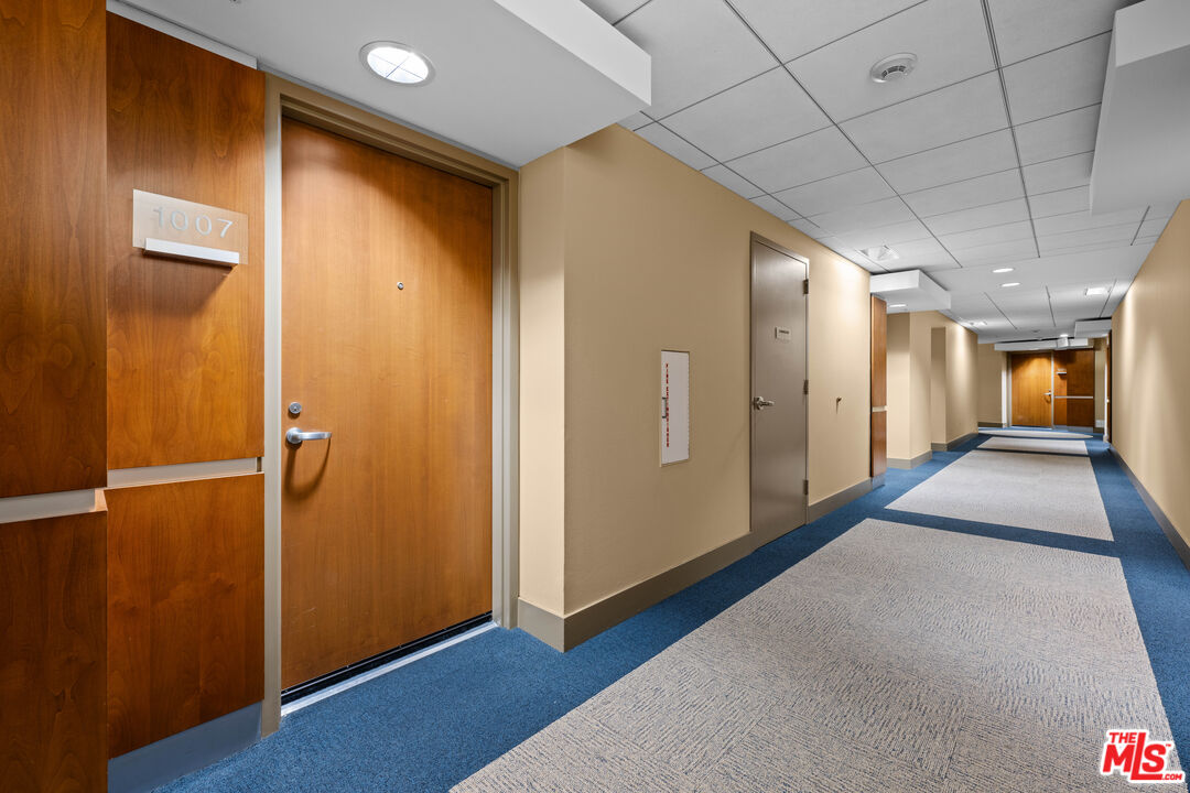 13700 Marina Pointe Drive, Unit 1007 Marina del Rey, CA 90292 - Photo 28 of 53 a view of a hallway with wooden floor